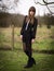 Beautiful Young Woman Dressed In Black in a Field