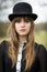 Beautiful Young Woman Dressed In Black Wearing Bowler Hat