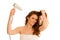 Beautiful young woman dries hair with a blow dryer