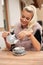 Beautiful young woman drink tea on bar terace in early autumn