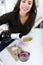 Beautiful young woman drinking some wine at home.