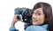 Beautiful young woman with DSLR video camera, on white