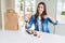 Beautiful young woman eating asian sushi from home delivery with surprise face pointing finger to himself