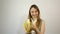 Beautiful young woman eating banana