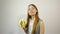 Beautiful young woman eating banana