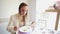 Beautiful young woman eating soup in restaurant