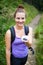 Beautiful young woman eating sweet blueberries