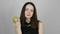 Beautiful young woman eats a green apple