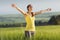 Beautiful young woman enjoying the spring standing in a cereal f