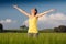 Beautiful young woman enjoying the spring standing in a cereal f