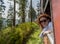 Beautiful young woman enjoying traveling by train