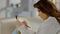 Beautiful young woman examining map, making notes with pencil