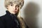 Beautiful Young Woman in Fur Hat. Pretty Blond Girl. Winter Fashion Beauty.Beautiful Blond Girl in Black Leather Gloves