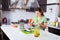 Beautiful young woman grating carrot