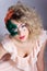 Beautiful young woman in a green mysterious venetian mask a new year carnival, Christmas masquerade, a dance club, secret nigh