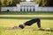 Beautiful young woman lying on a yellow mattress doing pilates or yoga, shoulder bridge beginner exercises