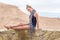 Beautiful young woman model posing desert.