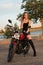 Beautiful young woman mount on motorcycle