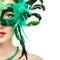 Beautiful young woman in mysterious green Venetian mask