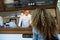 Beautiful young woman ordering food from the cook of a food truck.