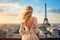 Beautiful young woman in Paris, Eiffel tower, France, Once in Paris. Back slim chic woman with long blond hair in dress on roof