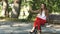 Beautiful young woman on a Park bench taking a selfie