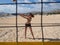 Beautiful young woman playing beachvolleyball