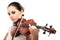 Beautiful young woman playing violin over white