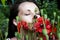 Beautiful young woman in poppy field. beautiful nature. Girl in poppy field inhales the scent of flowers. bouquet of color. Girl