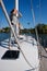 Beautiful young woman posing on yacht. Model is sailing on board