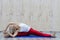 Beautiful young woman practices yoga asana Samakonasana Straight angle posture