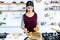 Beautiful young woman preparing toast with mashed vegetables in