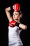 Beautiful young woman in a red boxing gloves