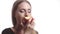 Beautiful young woman with red lips eating apple