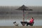 Beautiful young woman rests by the river Danube