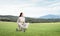 Beautiful young woman riding children`s bicycle