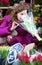 Beautiful young woman selecting flowers