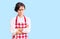 Beautiful young woman with short hair wearing professional cook apron skeptic and nervous, disapproving expression on face with