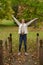 Beautiful young woman shown in park during fall