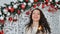 Beautiful young woman with sparkles over colorful background. Closeup beauty portrait of young girl holding sparklers