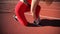 Beautiful young woman in a stadium on a red treadmill. A girl runs on a treadmill at the stadium.