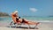 Beautiful young woman in straw hat and swimsuit