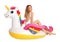 Beautiful young woman in stylish bikini with  unicorn inflatable ring on white