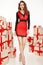Beautiful young woman thin slim figure evening makeup fashionable stylish coat, clothing collection, brunette, gifts boxes re