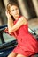 Beautiful young woman in vintage dress with retro auto