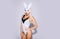 Beautiful young woman in white mysterious mask. Beautiful woman with babbit bunny mask on isolated background wirh copy