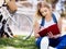 Beautiful young woman writing in her diary outdoors