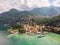 Beautifull aerial panoramic view from the drone to the Varenna - famous old Italy town on bank of Como lake. High top