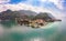 Beautifull aerial panoramic view from the drone to the Varenna - famous old Italy town on bank of Como lake. High top