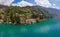 Beautifull aerial panoramic view from the drone to Varenna famous old Italy town on bank of Como lake. High top view to